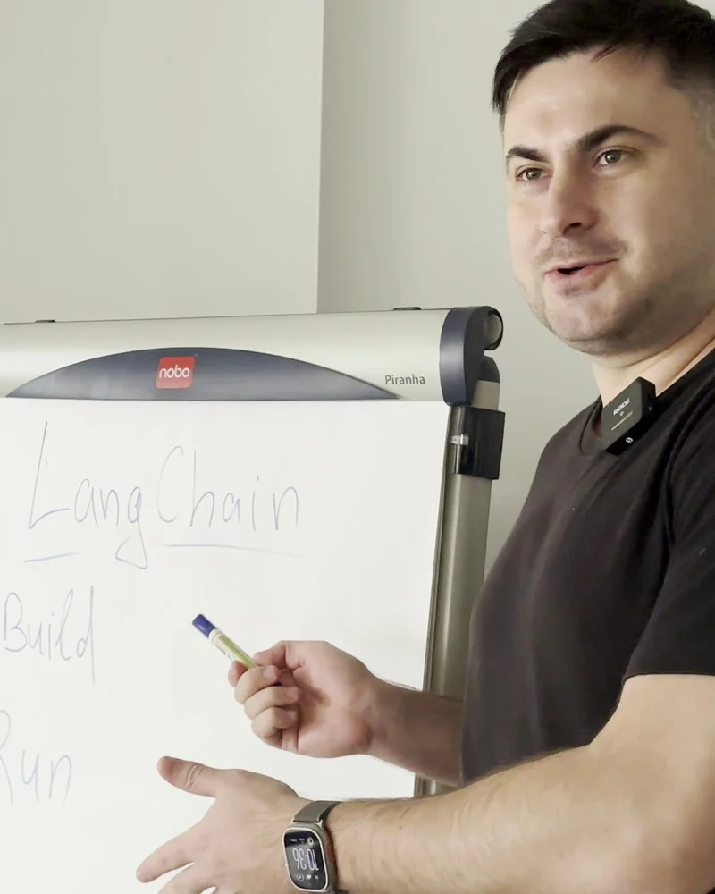 Nick Romanenko explaining software architecture at a flip chart